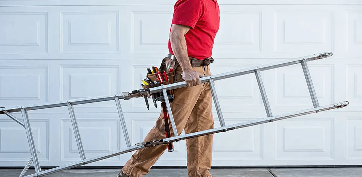 Garage door repair technician arriving with tools and ladder in Miami, FL