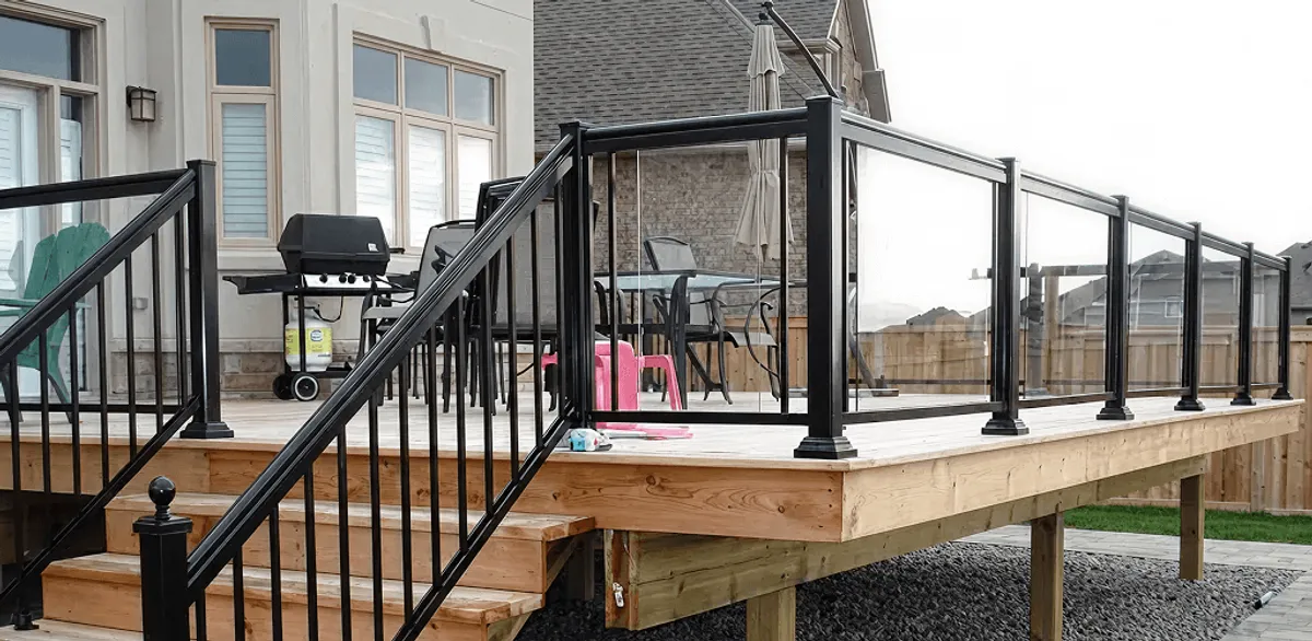 Handrail installation on a deck staircase for safety and code compliance in Miami, FL
